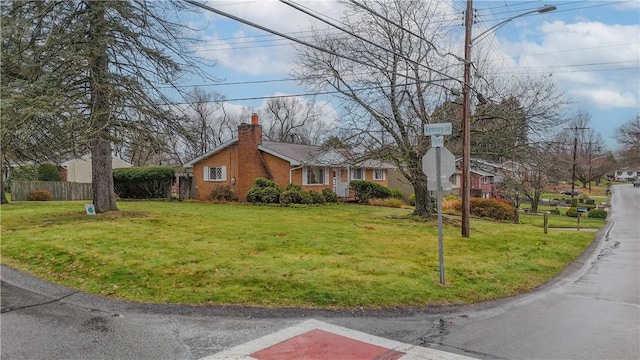 view of side of home featuring a lawn