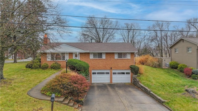 view of front of house with a garage and a front yard