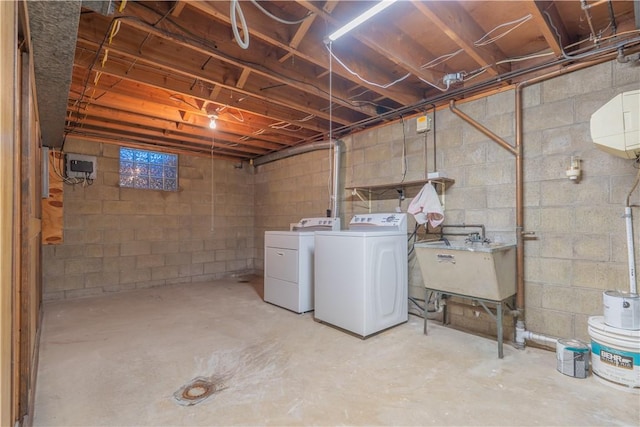 basement with independent washer and dryer and sink