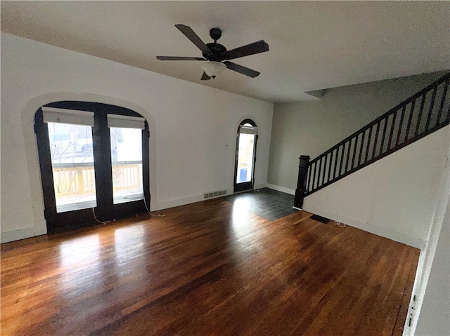 entryway with ceiling fan and dark hardwood / wood-style flooring