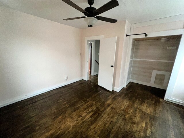 unfurnished bedroom with a closet, ceiling fan, and dark hardwood / wood-style flooring