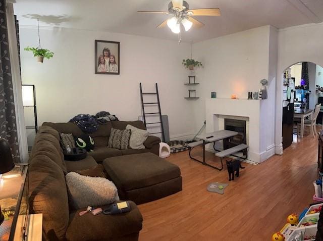 living room featuring hardwood / wood-style flooring and ceiling fan