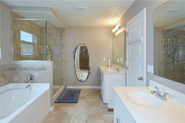 bathroom with plus walk in shower, a textured ceiling, and vanity