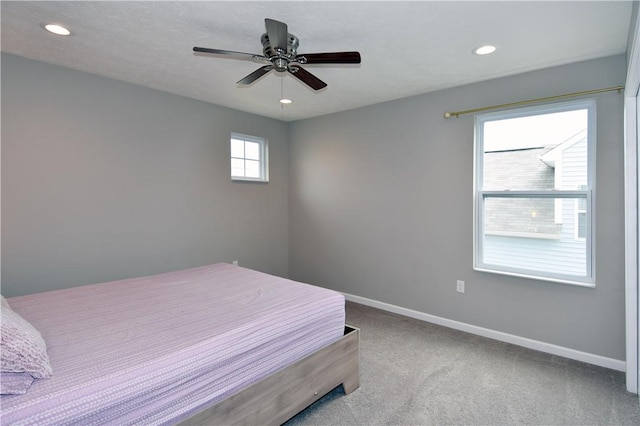 carpeted bedroom with ceiling fan