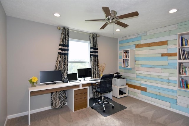 carpeted office with ceiling fan