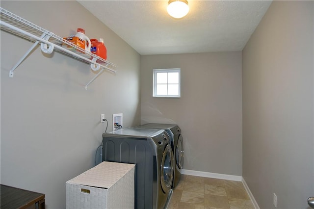 laundry room featuring separate washer and dryer