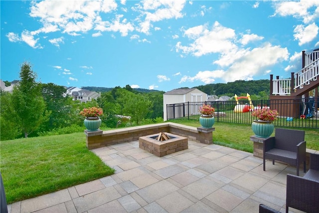 view of patio with a fire pit