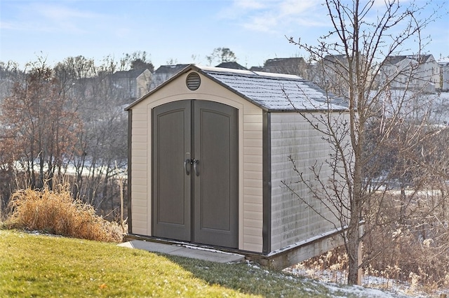 view of outbuilding with a lawn