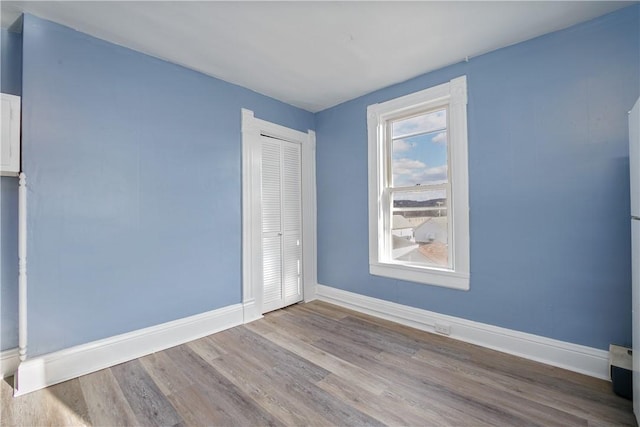 empty room featuring hardwood / wood-style floors