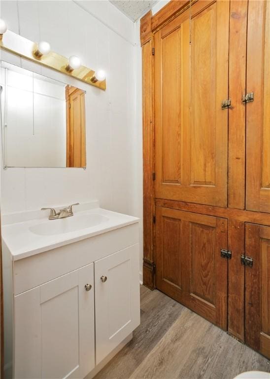 bathroom featuring vanity and wood-type flooring