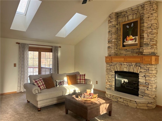 carpeted living room with lofted ceiling with skylight, baseboards, and a fireplace