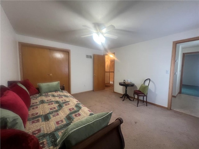 carpeted bedroom featuring ceiling fan