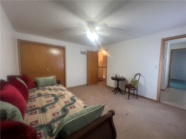 bedroom featuring a ceiling fan, carpet, baseboards, and visible vents