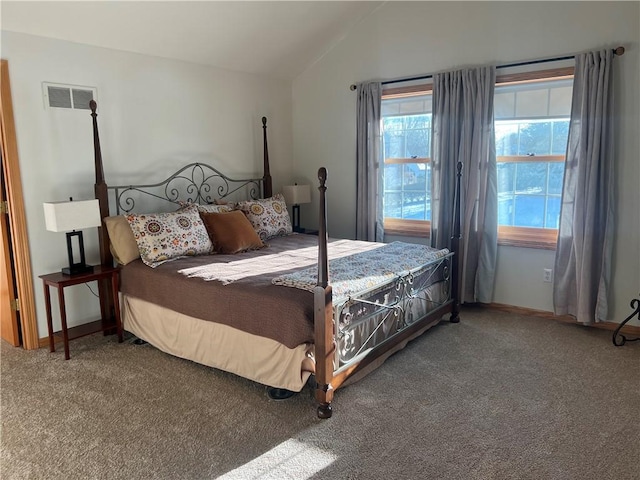 bedroom with carpet and vaulted ceiling