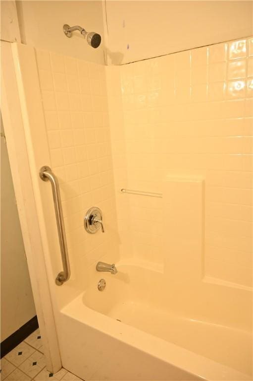 bathroom featuring tile patterned floors and  shower combination