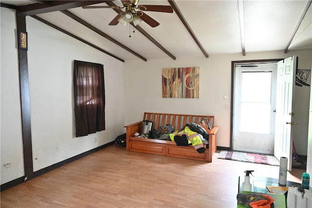 entrance foyer with lofted ceiling with beams, ceiling fan, and light wood-type flooring