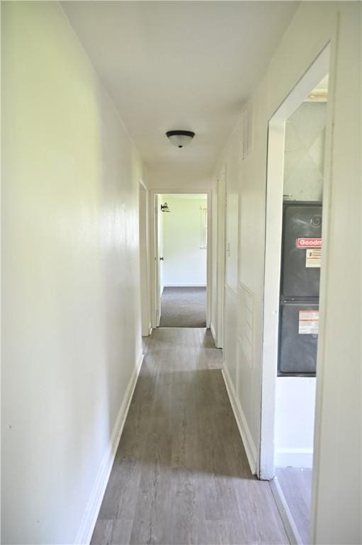 hallway featuring dark hardwood / wood-style flooring