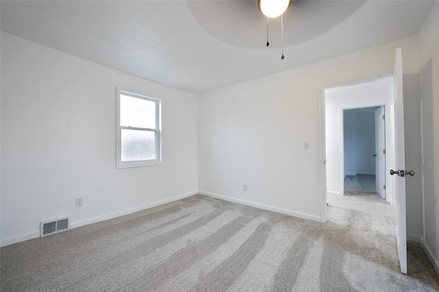 spare room with light colored carpet