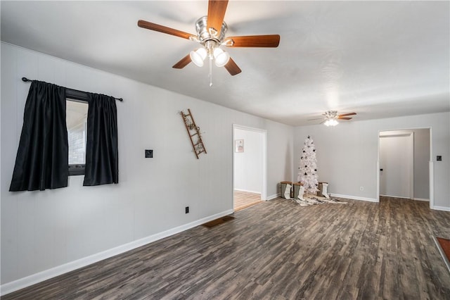 unfurnished living room with ceiling fan and dark hardwood / wood-style flooring