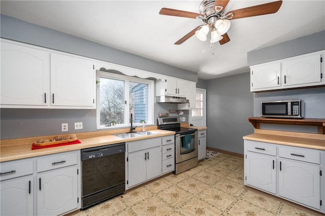 kitchen with ceiling fan, sink, white cabinetry, and stainless steel appliances