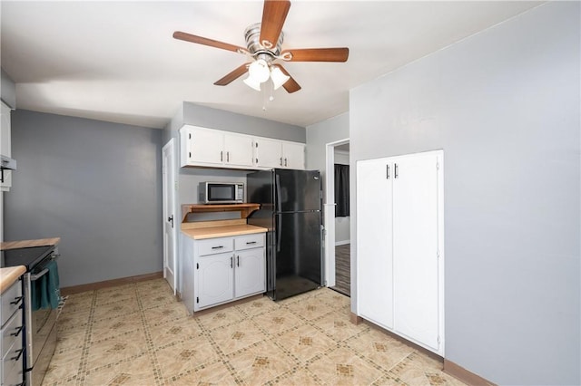 kitchen with white cabinets, stainless steel appliances, and ceiling fan