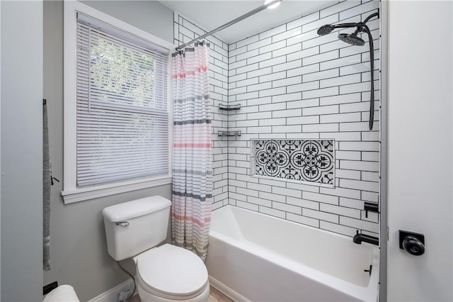 bathroom with toilet and shower / bath combo with shower curtain