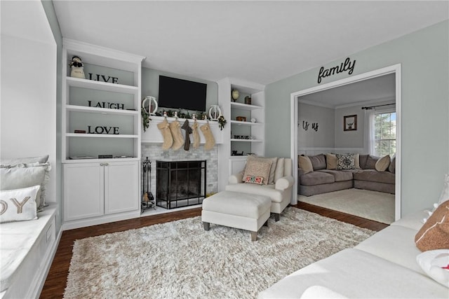 living room featuring dark hardwood / wood-style floors and built in features