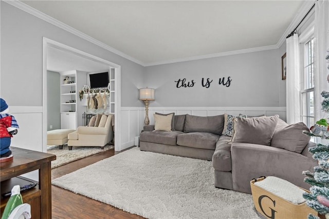 living room featuring hardwood / wood-style flooring and ornamental molding