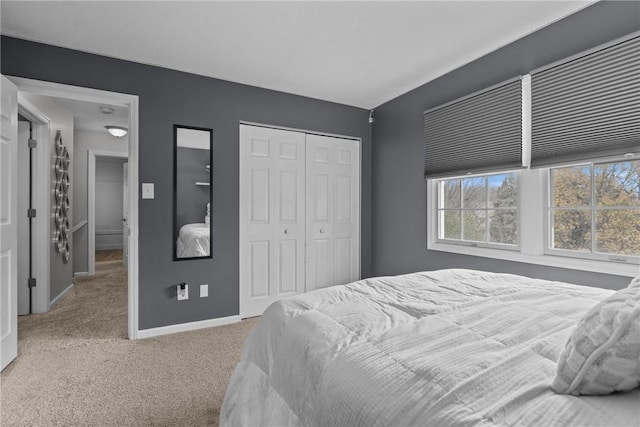 carpeted bedroom featuring a closet