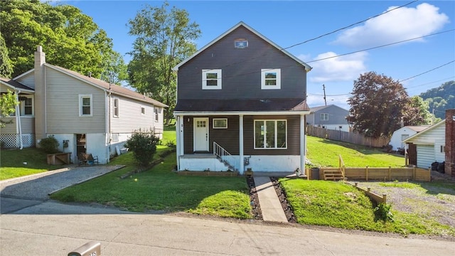 view of front of property featuring a porch and a front lawn