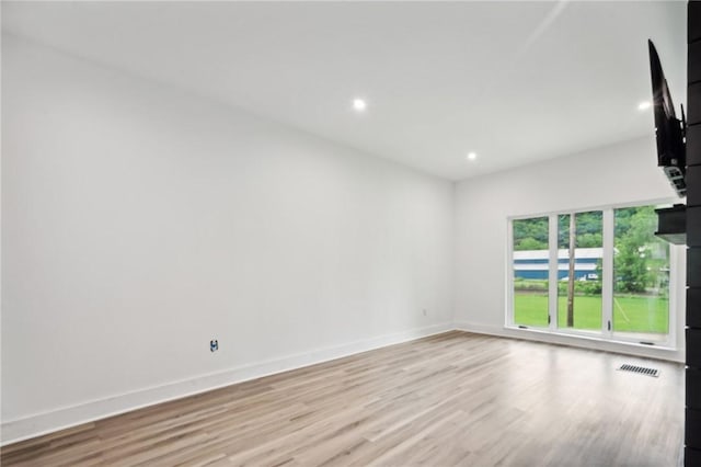 unfurnished room featuring light hardwood / wood-style flooring