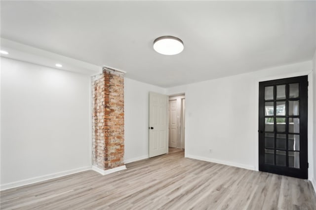 unfurnished room featuring light hardwood / wood-style floors