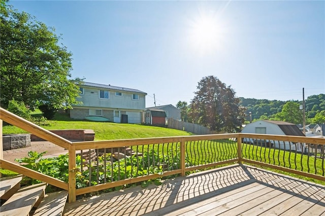 wooden deck featuring a yard