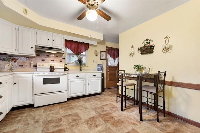 kitchen with backsplash, electric stove, ceiling fan, and white cabinets