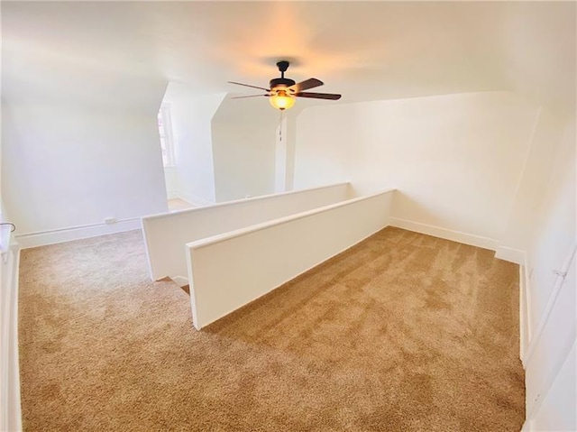 spare room featuring carpet flooring and ceiling fan