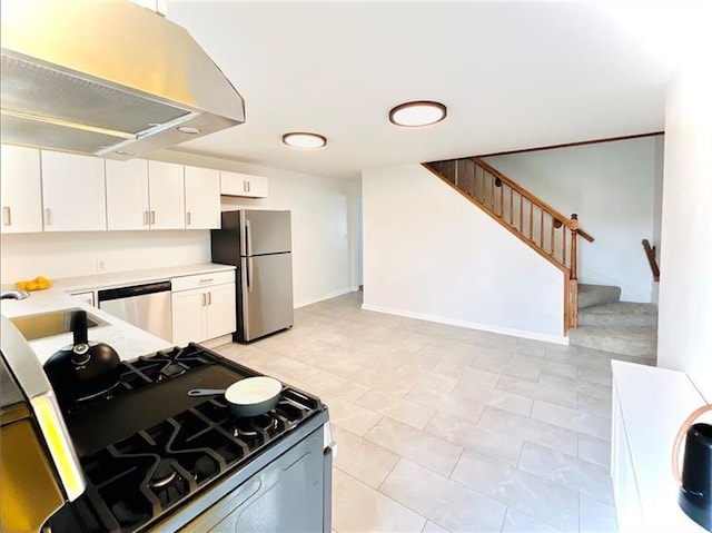 kitchen featuring white cabinetry, sink, ventilation hood, light tile patterned floors, and appliances with stainless steel finishes