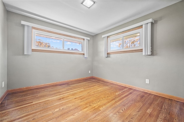 unfurnished room with light wood-type flooring