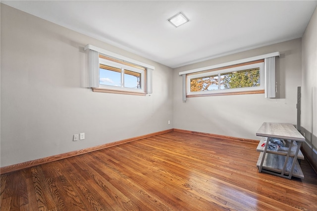 unfurnished room featuring hardwood / wood-style floors