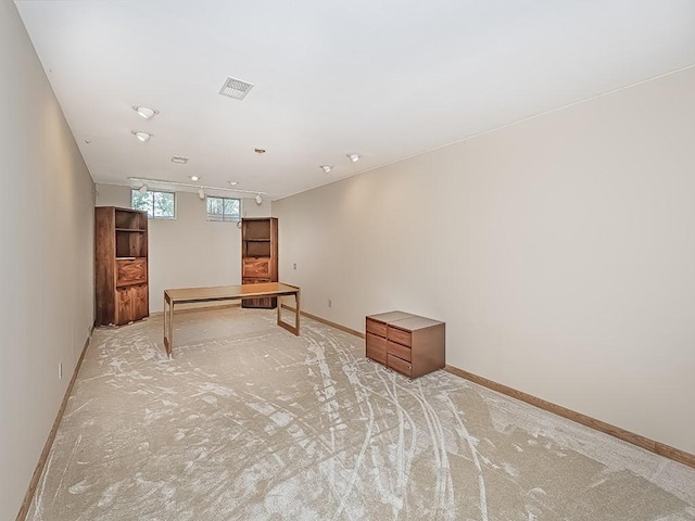 basement with light colored carpet