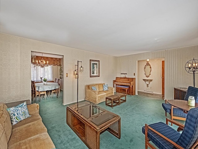 carpeted living room featuring a chandelier