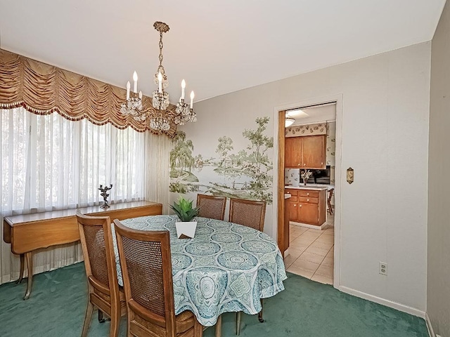 dining space featuring carpet floors and an inviting chandelier