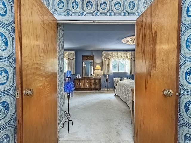 bedroom featuring light carpet