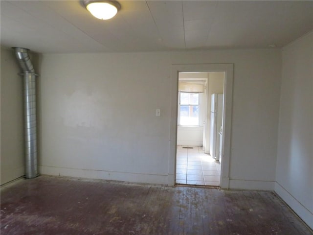 spare room with wood-type flooring