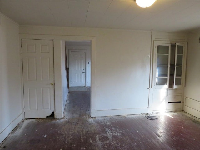 spare room featuring dark hardwood / wood-style floors