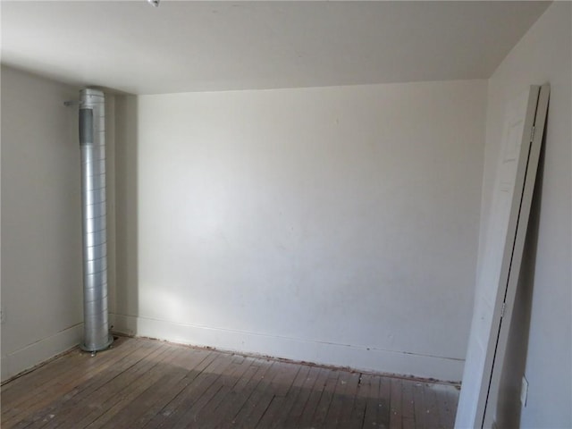 spare room featuring hardwood / wood-style floors