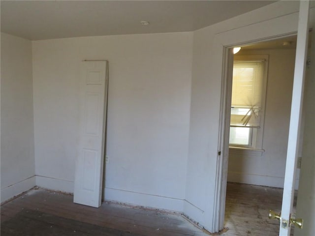 empty room featuring dark wood-type flooring