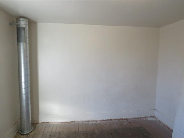 empty room with hardwood / wood-style flooring