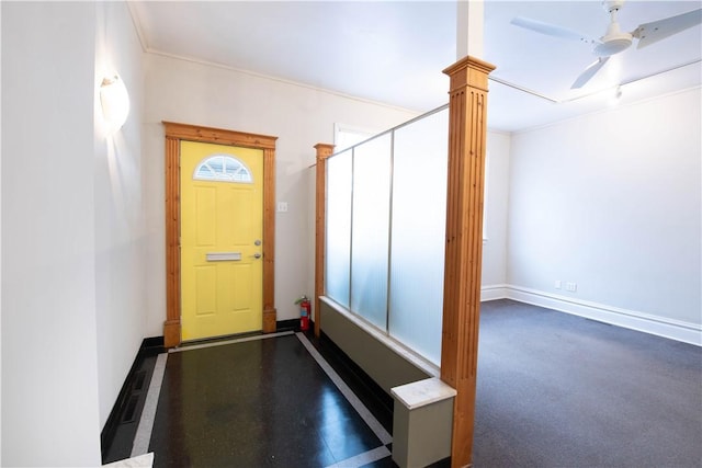 doorway to outside featuring ceiling fan and ornate columns