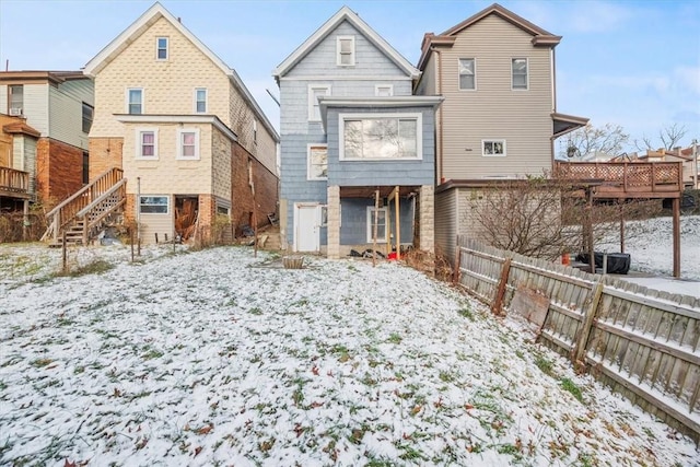 view of snow covered house