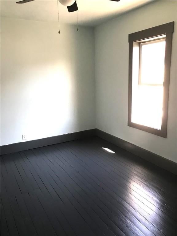 115 Ross St, Confluence Boro, PA 15424 - spare room featuring plenty of natural light, a ceiling fan, dark wood finished floors, and baseboards